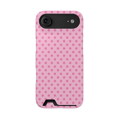 Pink dotted phone case held in hand