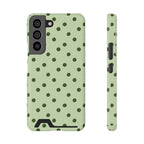 Sage green polka dot phone case with card holder, back view