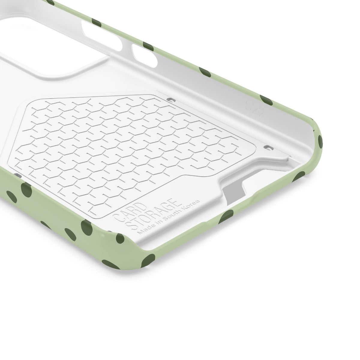 Sage green polka dot phone case with card holder, lifestyle view