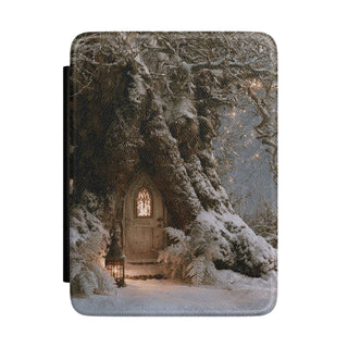 Winter fairy door Kindle case with snowy tree and glowing arched door
